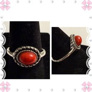 Ring - size 7.5 - silver tone stainless steel with red oval stone. New.  Lovely